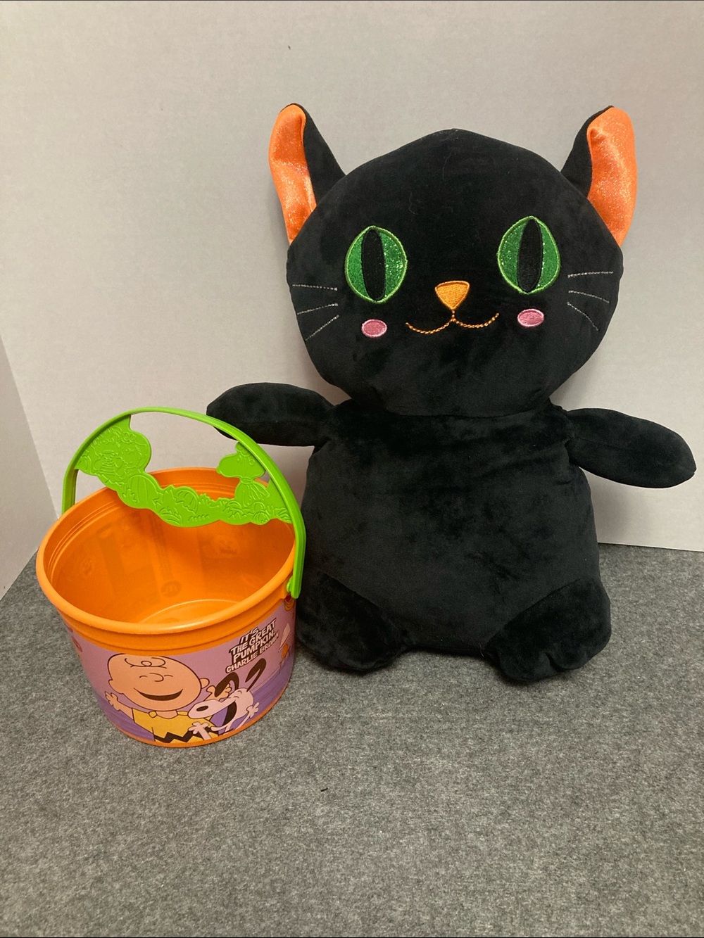 Halloween black cat plush and Charlie Brown trick or treat bucket from McDonald